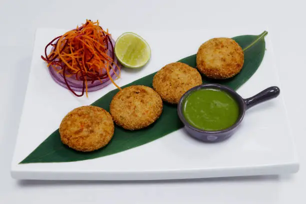 Photo of dahi kebab, deep fried spiced yoghurt patties rolled with semolina , indian snack food