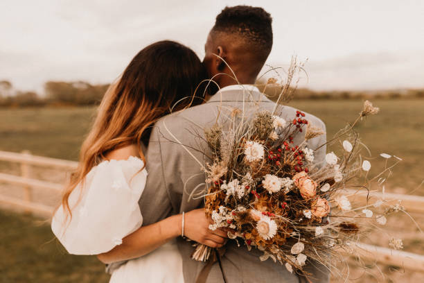 Elopement Wedding Young Black Couple Elope in Wales UK bunch of flowers photos stock pictures, royalty-free photos & images