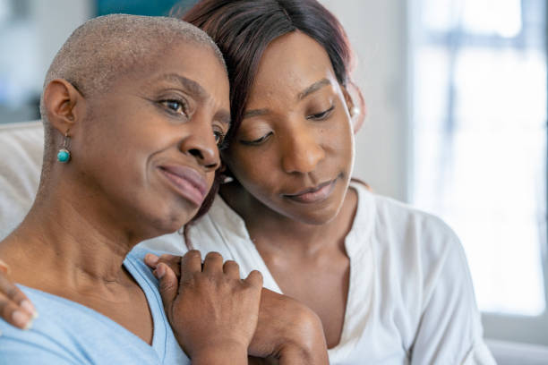istock Daughter embraces her mother after chemo 1334547860