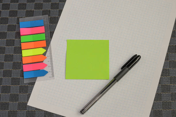 istock Multiple Assorted Collection Office Stationery Photo With Pens Pencils Notepads Notebook Ruler Stapler Scissors Clippers Paper Clips Holders Clipboard Placed Over Table 1334548290