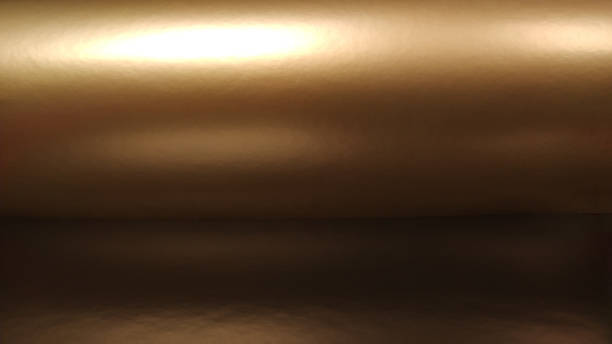 istock Gradient on a brown background. Horizontally folded shiny paper or foil with overflow and glare. Soft brown and beige color. Mysterious radiance. Northern Lights. Luxury fabric. Metallic gold glitter 1334548666