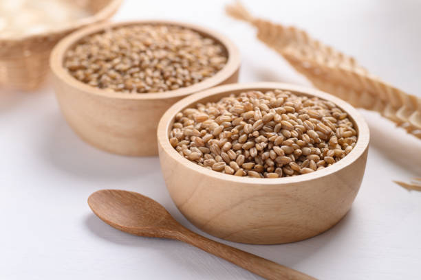 istock Wheat grain in a wooden bowl 1334553369
