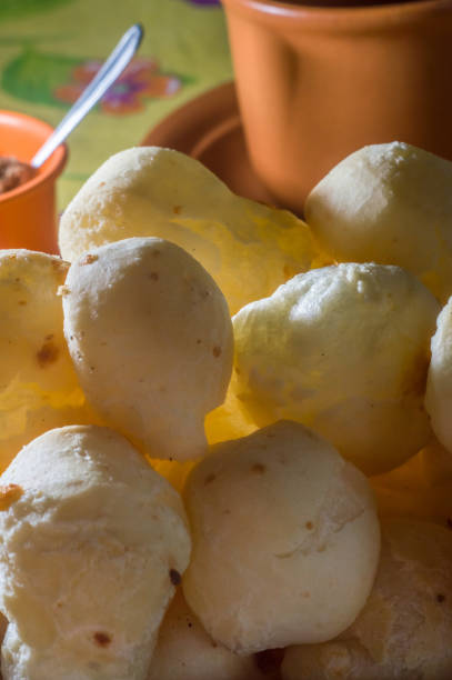 istock cheese buns with coffee on a yellow table and brown china, copy space 1334556326