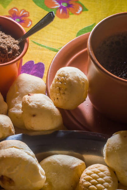 istock cheese buns with coffee on a yellow table and brown china, copy space 1334556360