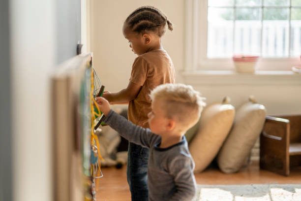 istock Nursery school friends learning togethehr 1334556378