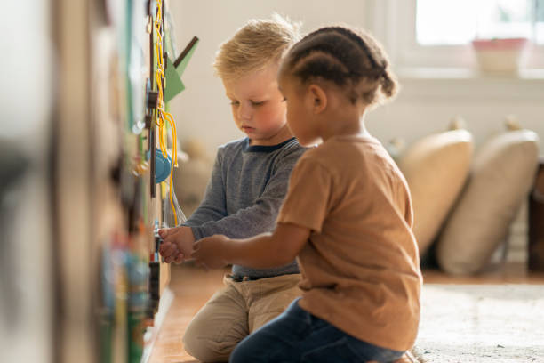 istock Nursery school friends learning togethehr 1334556384
