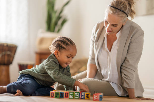 istock African preschool age boy with a therapist during play exercise 1334556561