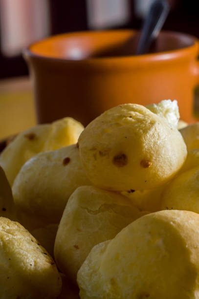 istock cheese buns with coffee on a yellow table and brown china, copy space 1334556614