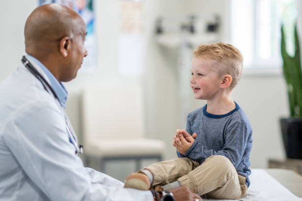 istock Young boy at a medical check up appointment 1334556652