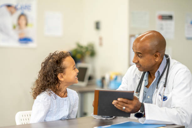 istock Five year old girl at a medical check up 1334556676