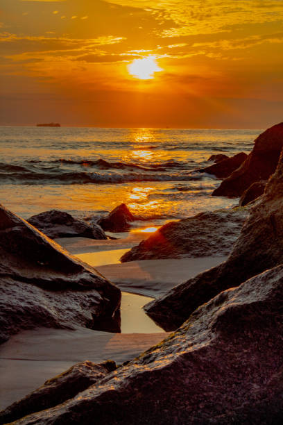 istock Sunrise at the Virginia Beach jetty 1334557423
