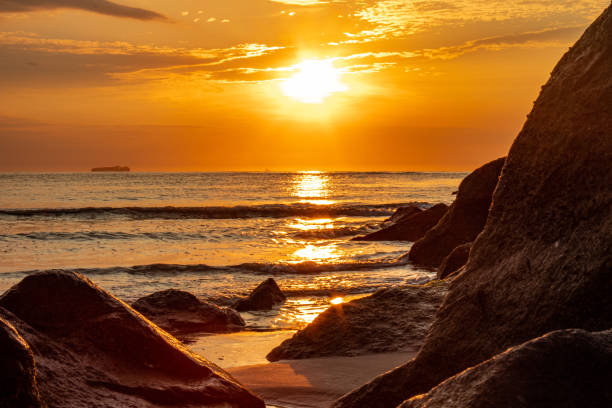 istock Sunrise at the Virginia Beach jetty 1334557648