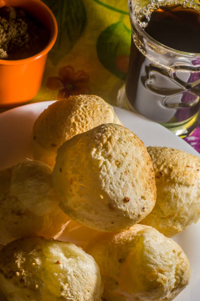istock cheese buns with coffee on a yellow table and brown china, copy space 1334557657