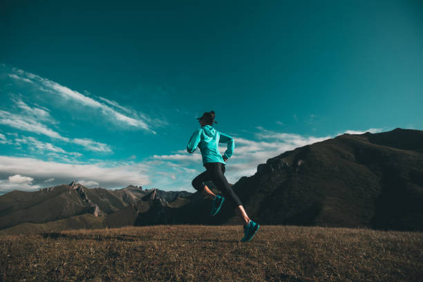 istock Young woman ultramarathon runner running at mountain top 1334563545