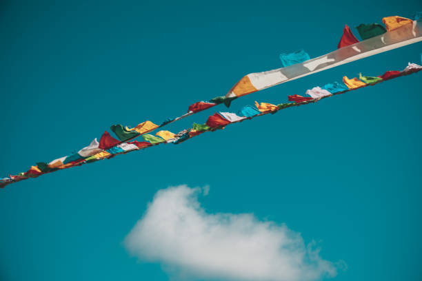istock Tibetan prayer flags under blue sky 1334563598