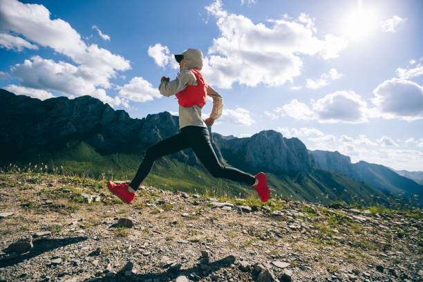 istock Woman ultramarathon runner running at mountain top 1334564505