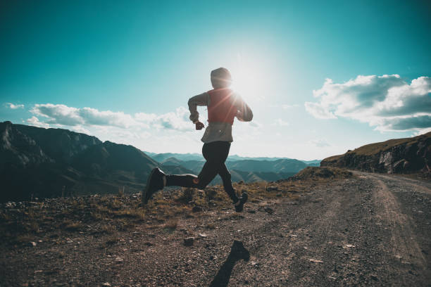 istock Woman ultramarathon runner running at mountain top 1334564601