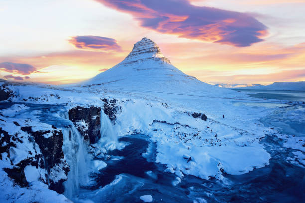 Kirkjufell mountain with water falls at winter, Iceland stock photo
