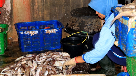 Workers processing fish in the fish drying industry, Batang, August 13, 2021
