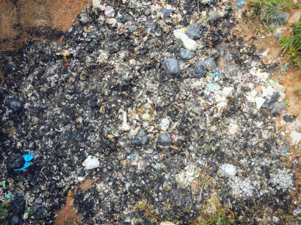 istock Aerial view landfill garbage waste huge dump environmental pollution problem, Top view on plastic and other industrial waste Ecological disaster from above with incinerate garbage burn global warming 1334565599