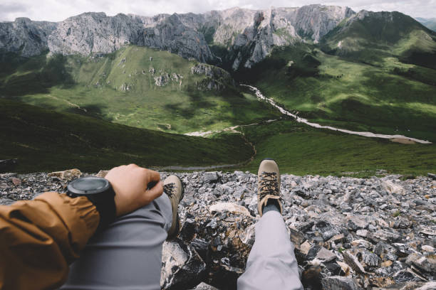 istock Hiker on high altitude mountain top enjoy the view 1334566275