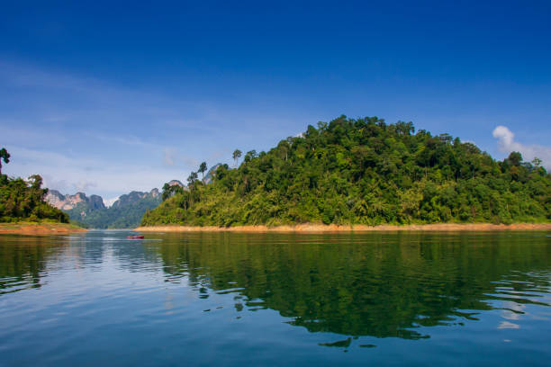 limestone Mountain and morning mist and beautiful view neture in the Cheow Lan dam Khao Sok National Park, Thailand stock photo