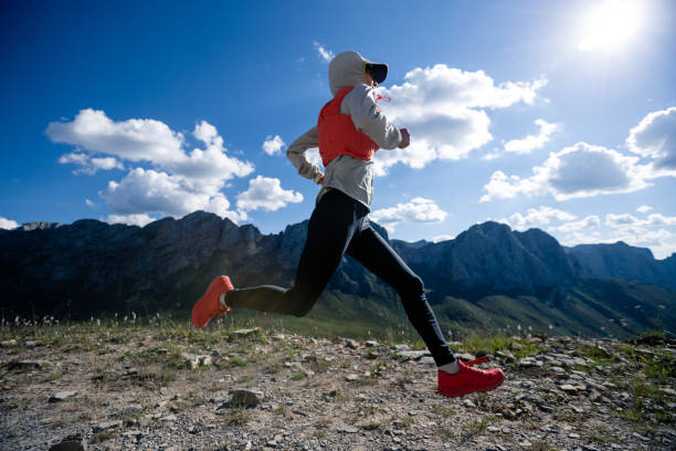istock Young woman ultramarathon runner running at mountain top 1334566942