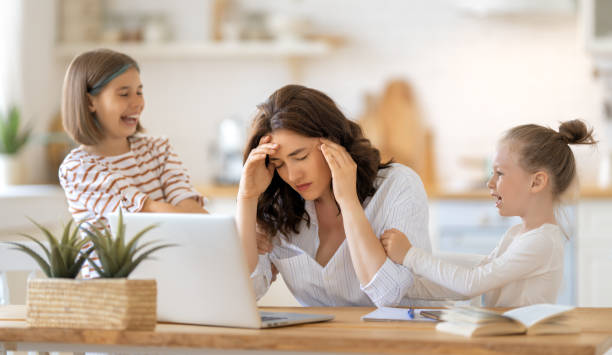 istock woman working on a laptop at home 1334567284