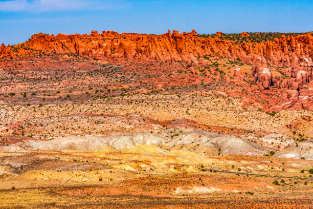 istock Painted Desert Orange Grass Sandstone White Sand Arches National Park Moab Utah 1334571420
