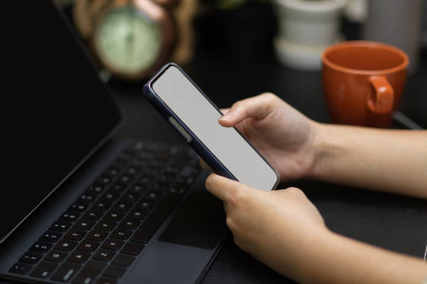 istock Close up female hands using smartphone to relax 1334571478