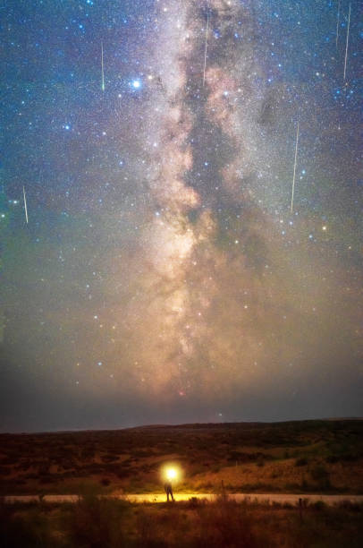 istock Hikers under the Milky way and meteors 1334572234