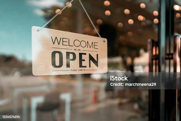 Open Cafe Or Restaurant Open Sign Board On Glass Door In Modern Cafe Coffee Shop Stock Photo - Download Image Now