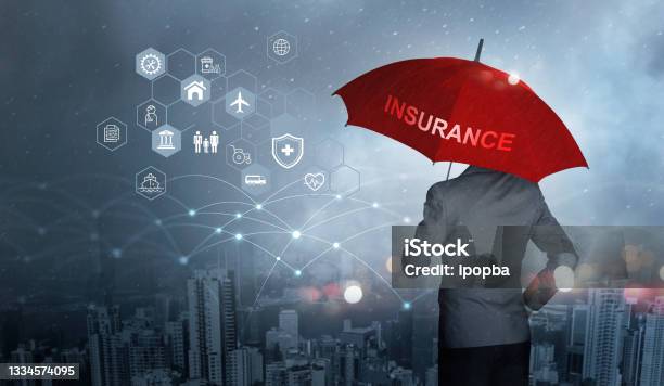 Insurance Concept Businessman Holding Red Umbrella On Falling Rain With Protect With Icon Business Health Financial Life Family Accident And Logistics Insurance On City Background Stock Photo - Download Image Now