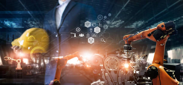 istock Industry 4.0. Smart industry robot arms control and operation on software by Engineer welding robotics in factory automotive industrial. Industry network connection icon. AI, Artificial Intelligence. Digital manufacturing operation. 1334574168