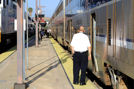 Moorpark, California, USA - May 03, 2019: Amtrak train attendant waiting for the departure, Moorpark Station.