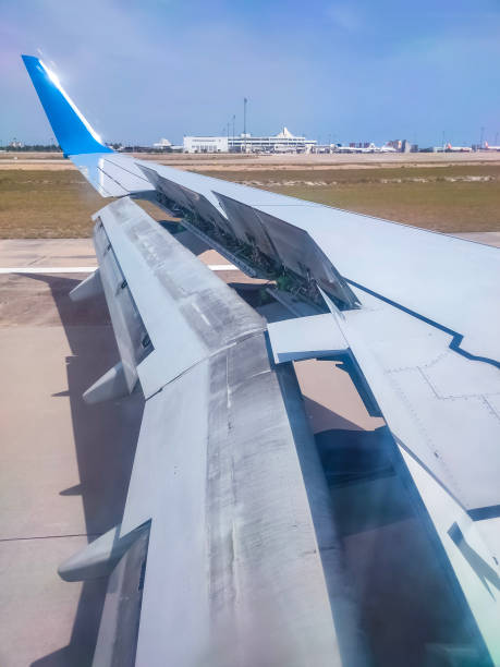 istock An airplane window view of wing and flaps after landing. 1334574982