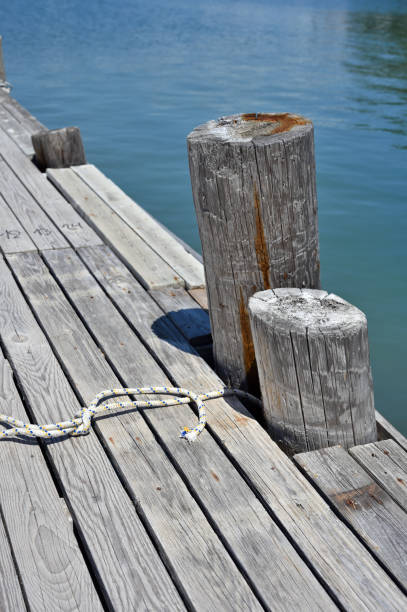 istock Old wooden pier on sea shore 1334575920