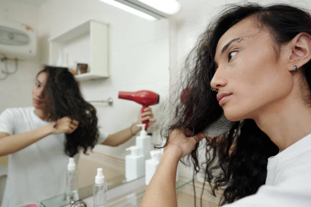 istock Man Blowing Out Long Curly Hair 1334575980