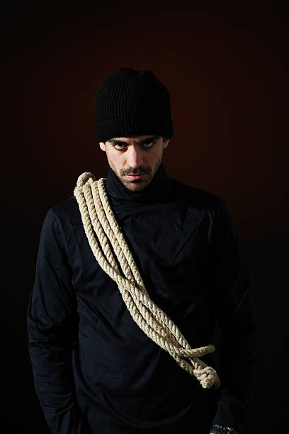 istock Mean looking thief on dark background _ Vertical 133457851