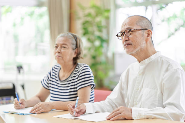 istock Elderly couple attending an inheritance seminar 1334581599