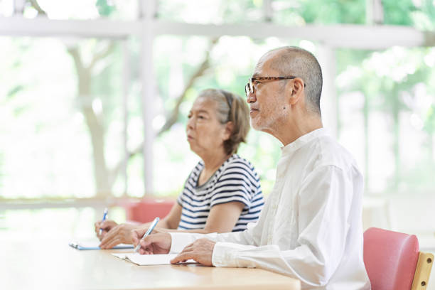 Elderly couple attending an inheritance seminar