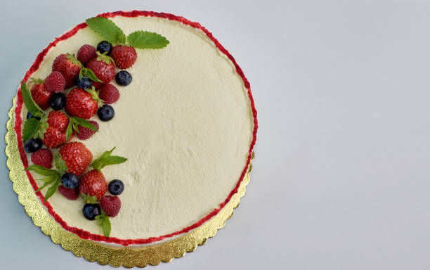 istock Freshly home made cake with berries on isolated white background 1334584336