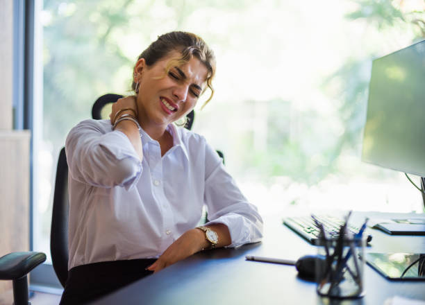 istock Businesswoman Having Neck Ache Due To Work Over Load And Bad Posture 1334586037