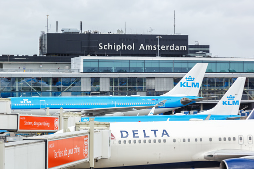 Amsterdam, Netherlands - May 21, 2021: Airplanes at Amsterdam Schiphol airport (AMS) in the Netherlands.