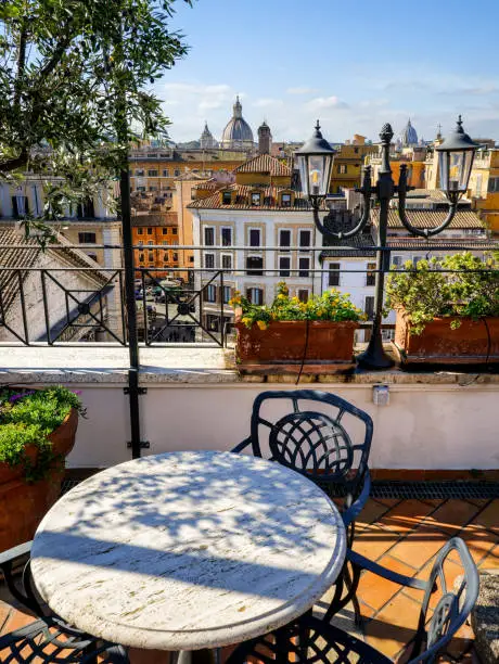 Photo of A beautiful cityscape over the rooftops of the historic center of Rome seen from a terrace in the Pantheon district