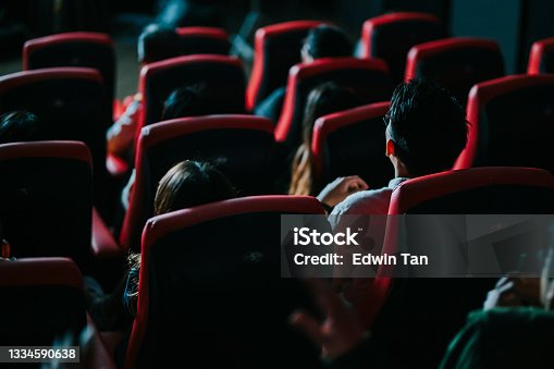 istock rear view asian chinese group of audience watching 3D movie in cinema enjoying the show with 3D glasses screaming excitement 1334590638
