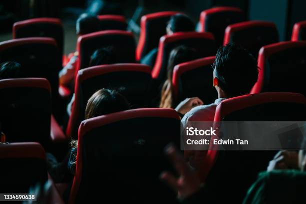 Rear View Asian Chinese Group Of Audience Watching 3d Movie In Cinema Enjoying The Show With 3d Glasses Screaming Excitement Stock Photo - Download Image Now