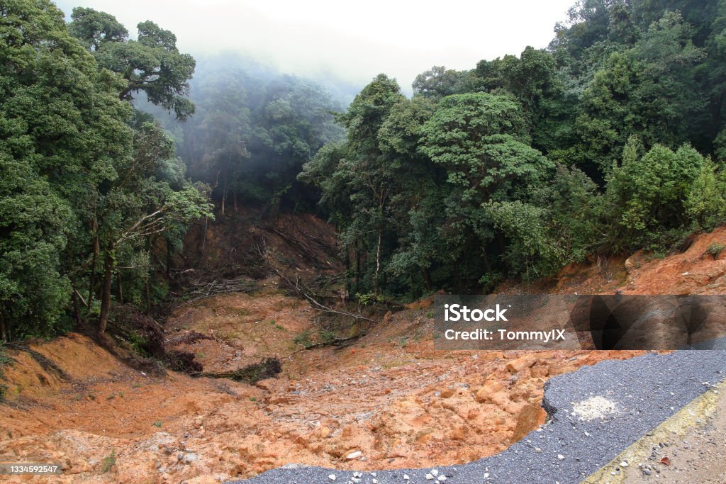 Foothill landslide Collapse asphalt road cause by heavy rain due to foothill landslide Landslide Stock Photo