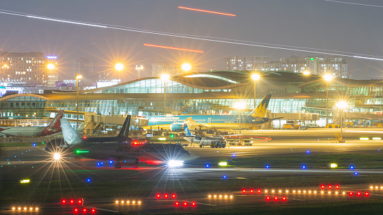 Ho Chi Minh city, July 27th 2020: the high traffic scene of Tan Son Nhat international airport at night time.