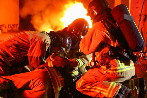 istock Firefighters helping their injured friend 1334593004